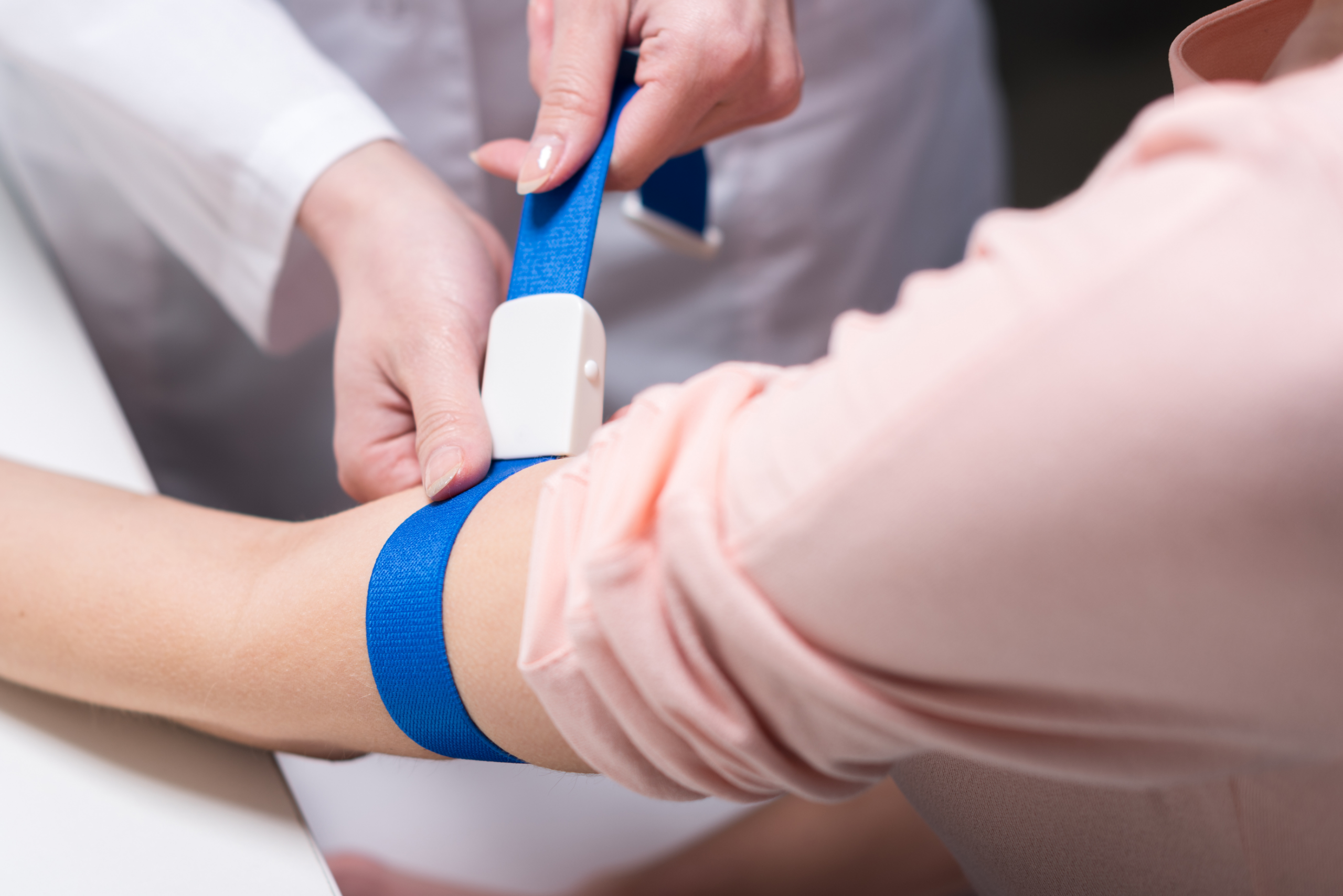 Menopause specialist consulting with a patient about blood tests